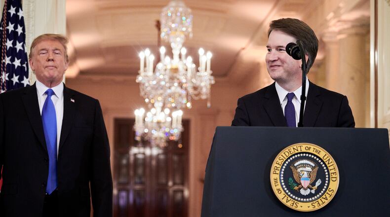 Judge Brett Kavanaugh speaks after President Donald Trump, left, announced him as the Supreme Court nominee in the East Room of the White House in Washington, July 9, 2018. (T.J. Kirkpatrick/The New York Times)