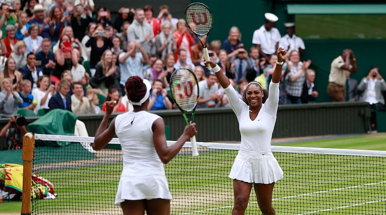 LONDON, ENGLAND - JULY 09: Venus Williams of The United States and Serena Williams of The United States celebrate victory in the Ladies Doubles Final against Timea Babos of Hungary and Yaroslava Shvedova of Kazakhstan on day twelve of the Wimbledon Lawn Tennis Championships at the All England Lawn Tennis and Croquet Club on July 9, 2016 in London, England. (Photo by Adam Pretty/Getty Images)