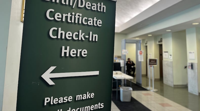 A sign at the office of vital statistics at
Public Health – Dayton & Montgomery County, located on South Main Street in downtown Dayton. Ohio has seen more deaths than births during the pandemic. CORNELIUS FROLIK / STAFF