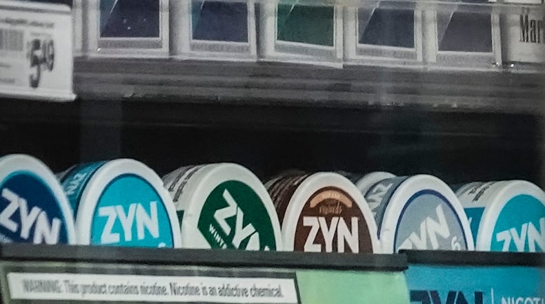 FILE - Containers of Zyn, a smokeless nicotine pouch, are displayed for sale among other nicotine and tobacco products at a newsstand on Feb. 23, 2024, in New York. (AP Photo/Bebeto Matthews, File)