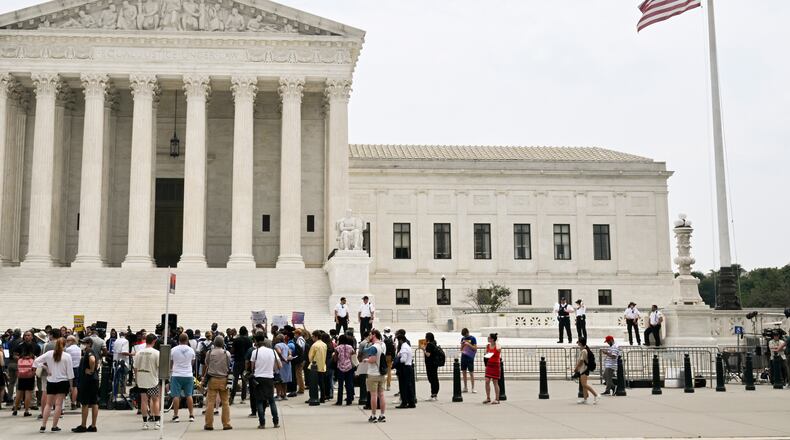 Demonstrators in favor of cancelling student debt outside the Supreme Court in Washington, June 30, 2023. The Supreme Court ruled on Friday that the Biden administration had overstepped its authority with its plan to wipe out more than $400 billion in student debt, dashing the hopes of tens of millions of borrowers and imposing new restrictions on presidential power. (Kenny Holston/The New York Times)