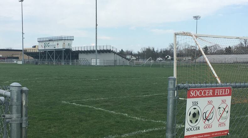 The grass fields between I-75 and West Carrollton’s stadium were the subject of a lawsuit settled earlier this decade. JEREMY KELLEY/STAFF