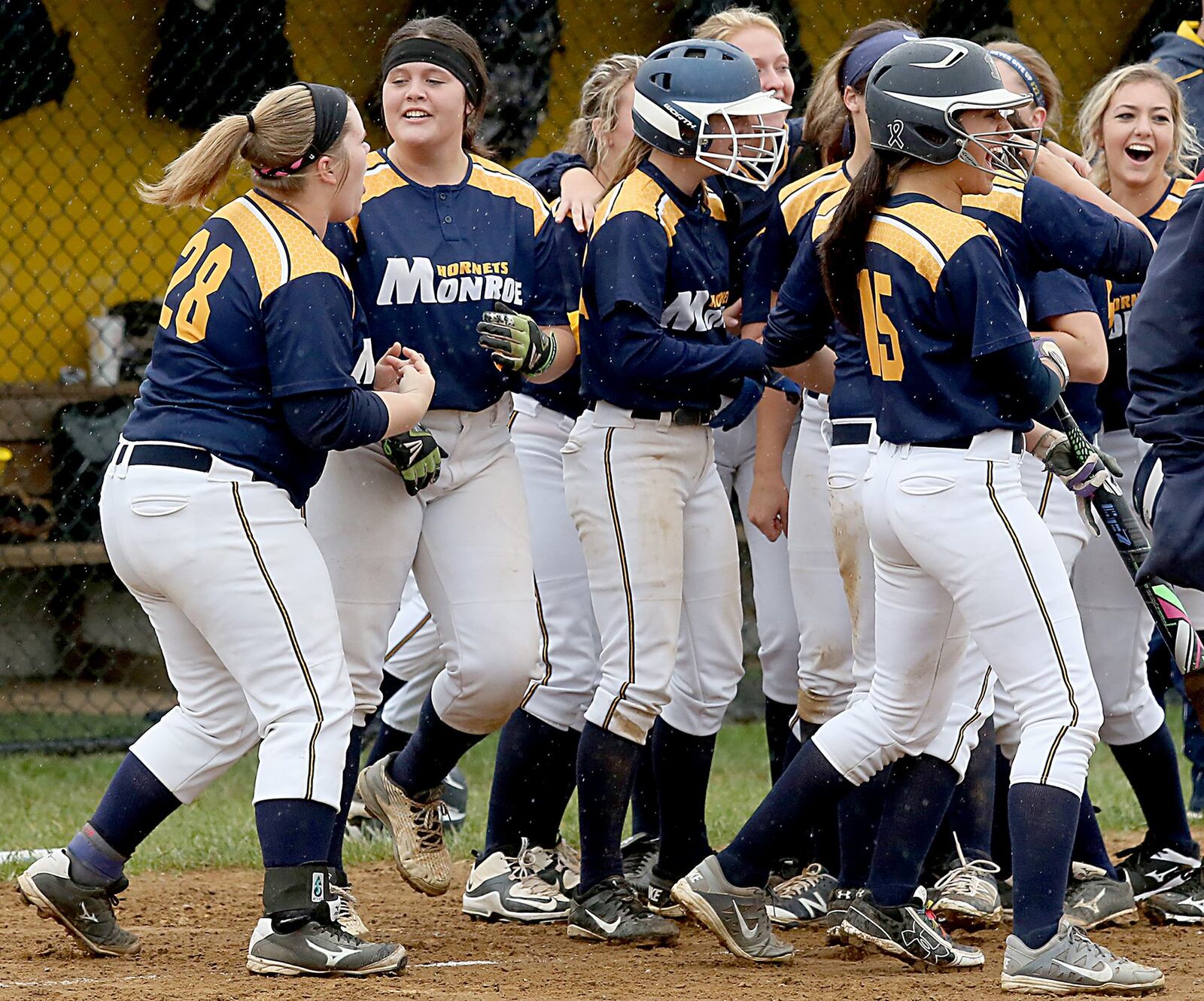 Mikayla Decker (28) is among the Monroe Hornets celebrating their run-rule victory over visiting Franklin on Wednesday. CONTRIBUTED PHOTO BY E.L. HUBBARD