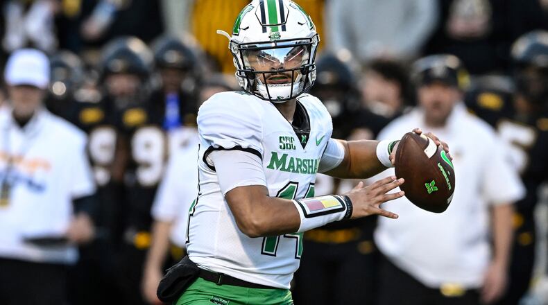 Marshall quarterback Cam Fancher drops back to pass during the first half of the team's NCAA college football game against Appalachian State on Saturday, Nov. 4, 2023, in Boone, N.C. (AP Photo/Matt Kelley)