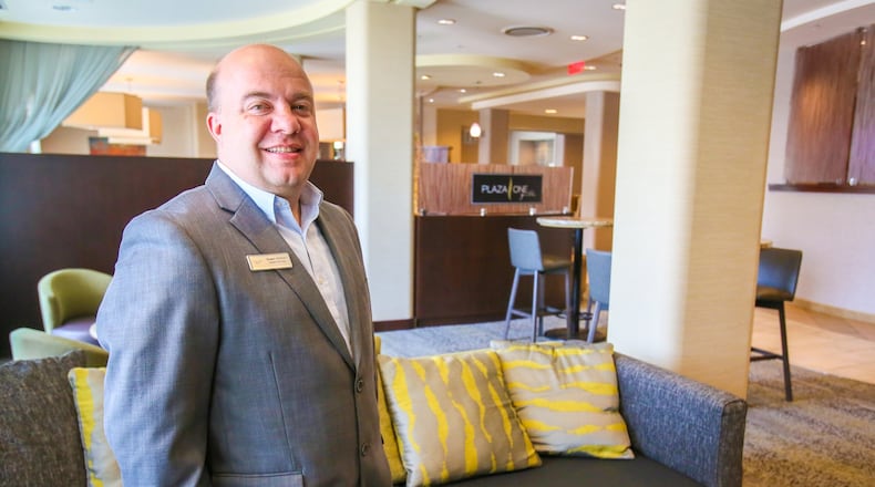 Courtyard by Marriott Hamilton General Manager Shawn Stidham in the newly renovated lobby at the hotel, Wednesday, July 5, 2017. GREG LYNCH / STAFF