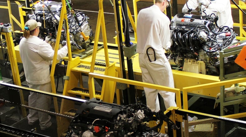 In this file photo from 2013, Honda workers at the company's Anna engine plant in Shelby County work on engines for the Honda Accord. Honda photo