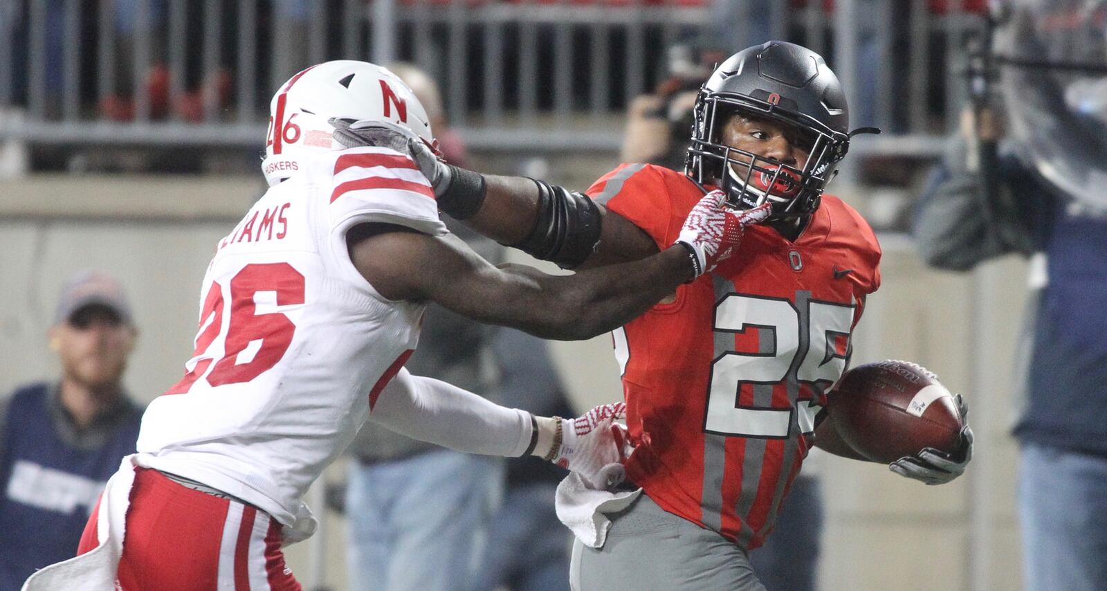 Ohio State’s Mike Weber fends off Nebraska’s Kieron Williams on a touchdown run in the first half on Saturday, Nov. 5, 2016, at Ohio Stadium in Columbus. David Jablonski/Staff