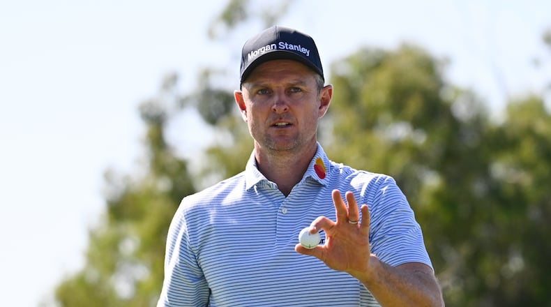 Justin Rose, of England, acknowledges the gallery after making a putt on the sixth green of the South Course at Torrey Pines during the third round of the Farmers Insurance Open golf tournament Saturday, Jan. 31, 2026, in San Diego. (AP Photo/Denis Poroy)