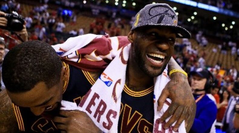 LeBron James and J.R. Smith #5 of the Cleveland Cavaliers celebrate their win over the Toronto Raptors in game six of the Eastern Conference Finals on May 27, 2016 in Toronto, Canada. (Photo by Vaughn Ridley/Getty Images)