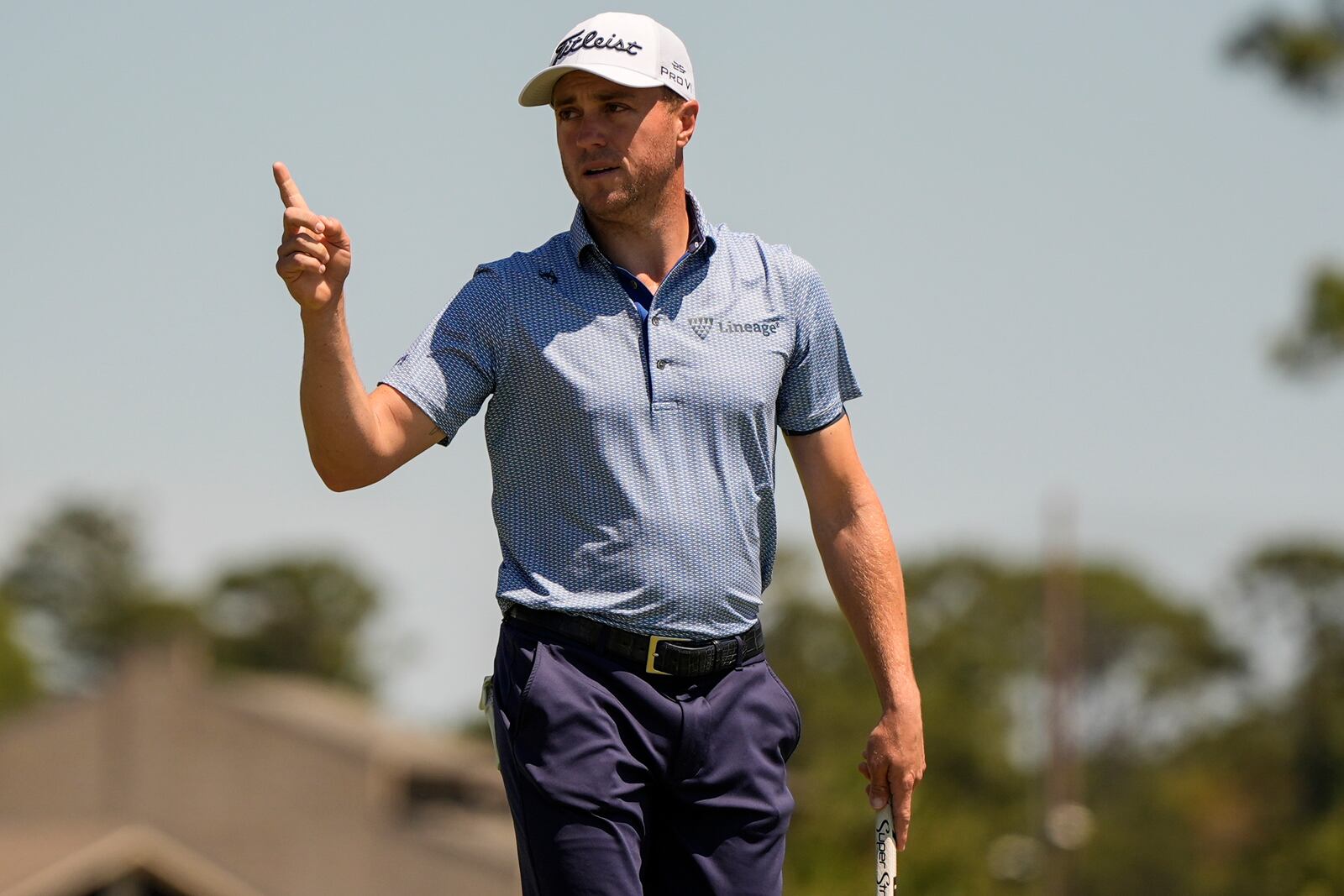 Justin Thomas waves to the crowd on the 17th green during the first round of the RBC Heritage golf tournament, Thursday, April 17, 2025, in Hilton Head Island, S.C. (AP Photo/Mike Stewart)