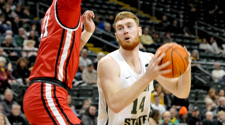 Wright State's Brandon Noel, 14, prepares to take a shot against Youngstown State's William Dunn, 11, during the first half of a Horizon Conference game at the Nutter Center on Sunday, Dec. 4. Noel scored 24 points and had 10 rebounds in Thursday's loss at Oakland. DAVID A. MOODIE/CONTRIBUTING PHOTOGRAPHER