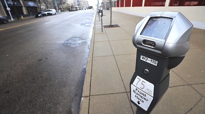 Due to the coronavirus pandemic, and people working from home, there are lots of parking spaces downtown on Friday morning March 20, 2020. Staff photo: MARSHALL GORBY
