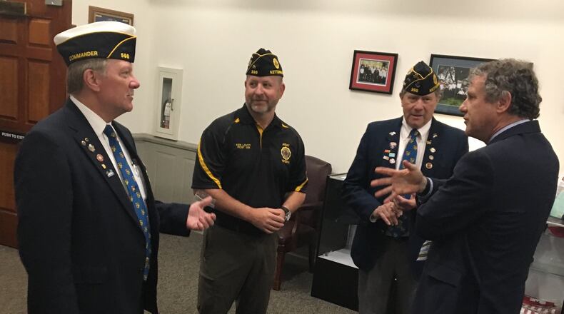 Sen. Sherrod Brown, D-Ohio, speaks with veterans at American Legion Post 598 in Kettering. Brown was in the area this week to drum up support for his bill that would require the federal government to buy American flags that are made only with U.S. materials inside the country.