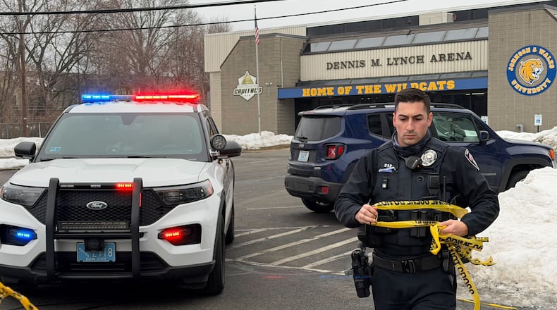 Police continue to tape off the Dennis M. Lynch arena a day after a deadly shooting during a youth hockey game on Tuesday, Feb. 17, 2026 in Pawtucket, R.I. (AP Photo/Rodrique Ngowi)
