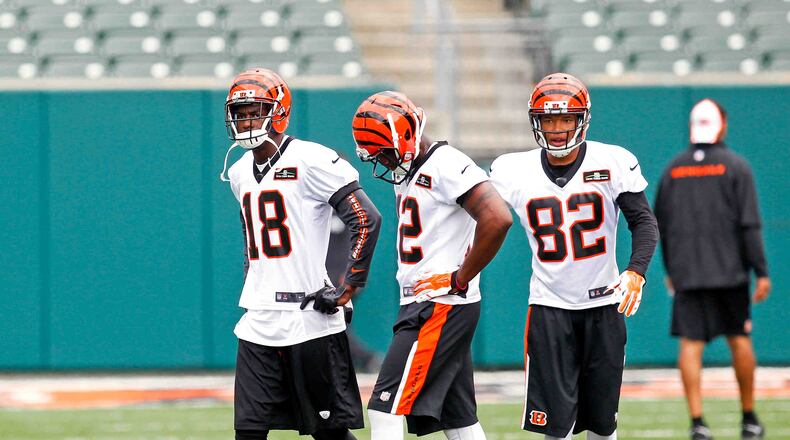 Cincinnati Bengals wide receivers A.J. Green (18), Mohamed Sanu (12) and Marvin Jones (82) participate in Official Team Activities Tuesday, June 3, 2014, at Paul Brown Stadium in Cincinnati. NICK DAGGY / STAFF