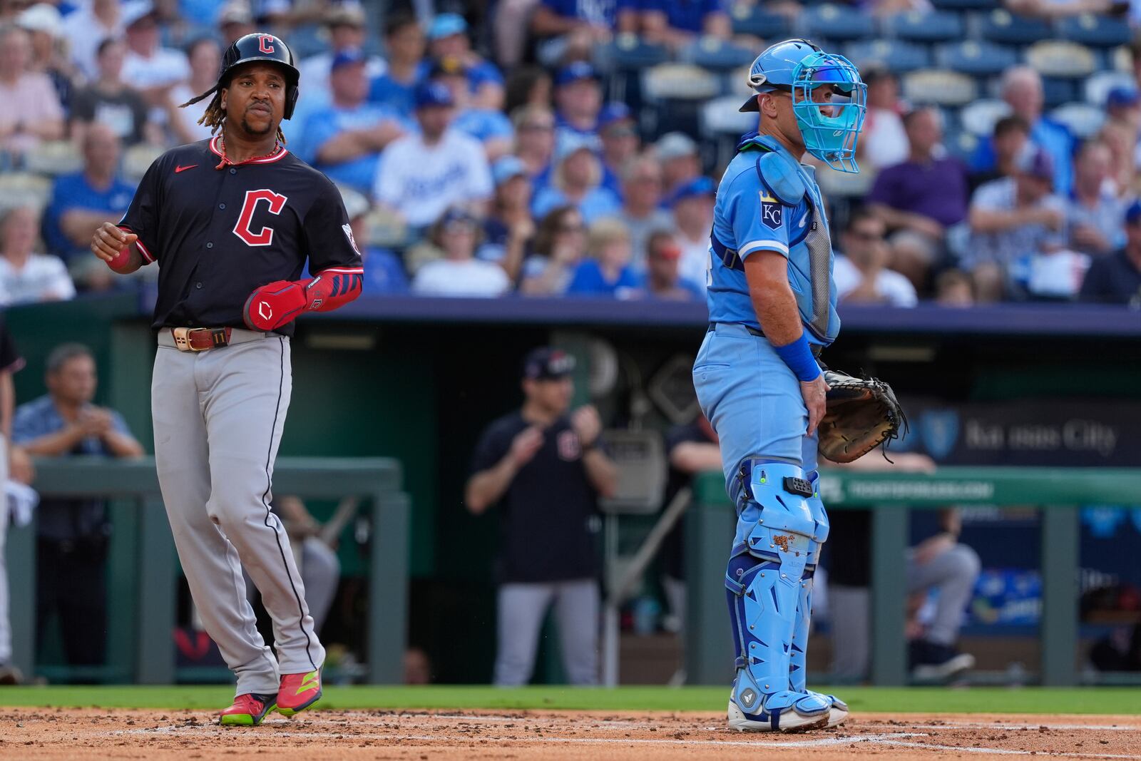 Cleveland Guardians' Jose Ramirez runs home to score past Kansas City Royals catcher Freddy Fermin on a two-run double hit by Johnathan Rodriguez during the first inning in the second baseball game of a doubleheader against the Kansas City Royals, Saturday, July 26, 2025, in Kansas City, Mo. (AP Photo/Charlie Riedel)