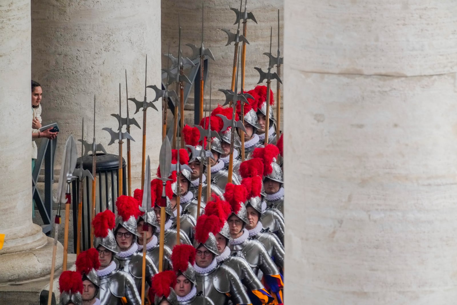 Pontifical Swiss guards arrive for the Easter mass in St. Peter's Square at the Vatican Sunday, April 20, 2025. (AP Photo/Gregorio Borgia)