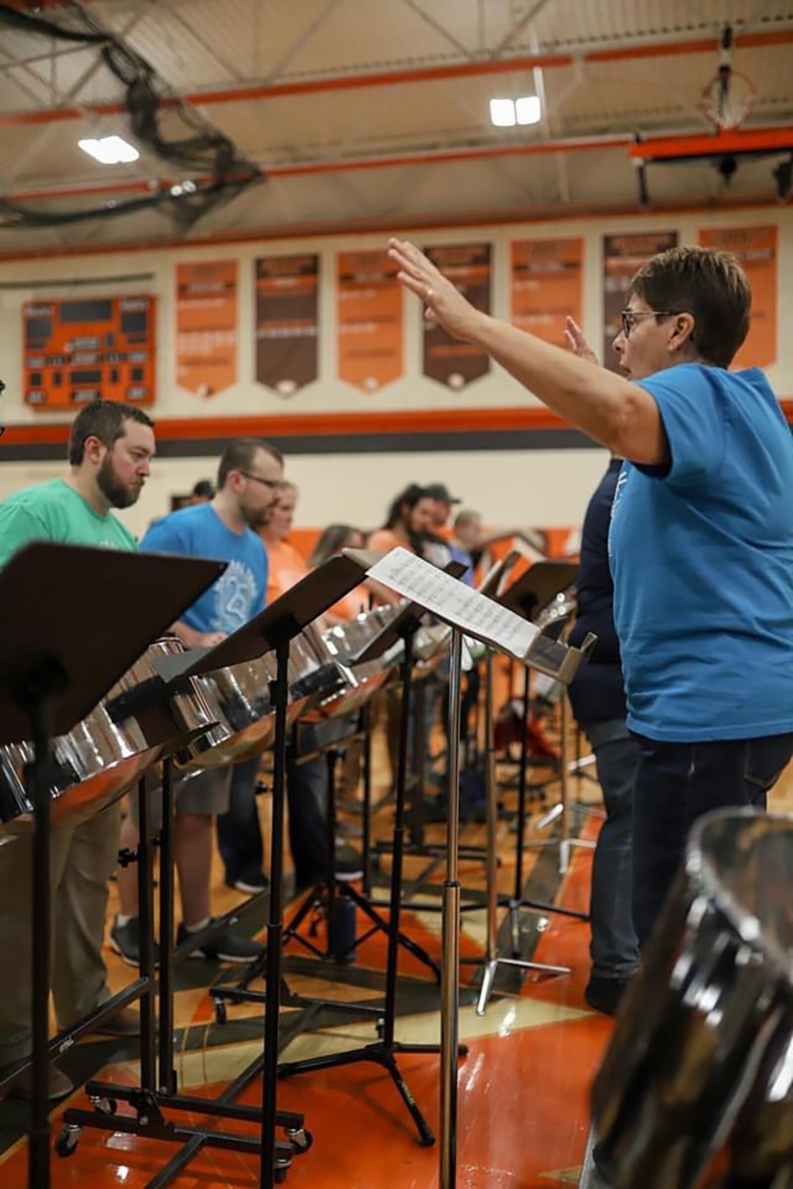 Marta Wetzel directing the alumni band at the 25th anniversary of the steel drum festival at National Trails school, last school year.