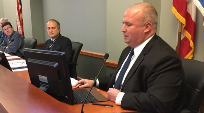 Terry Posey Jr. (near) Tuesday night was sworn in as Miami Twp.’s newest trustee, joining Don Culp (center) and John Morris. CONTRIBUTED