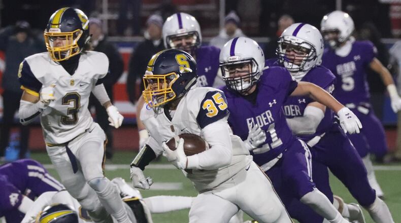Springfield’s Jeff Tolliver runs the ball against Elder during a Division I state semifinal on Nov. 29, 2019, at Piqua. Bill Lackey/STAFF