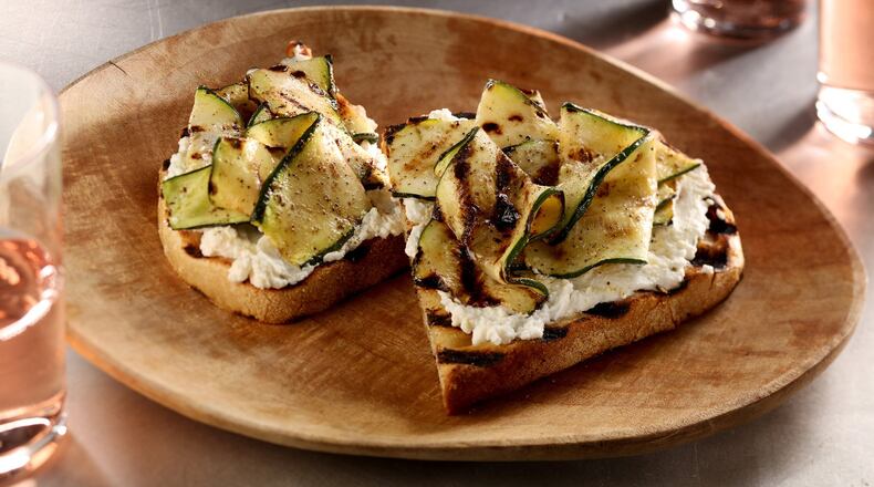 For a light summery lunch or simple appetizer, grill up some rustic bread, slather it with garlic-oil doused ricotta and top with grilled zucchini ribbons. (Michael Tercha/Chicago Tribune/TNS)