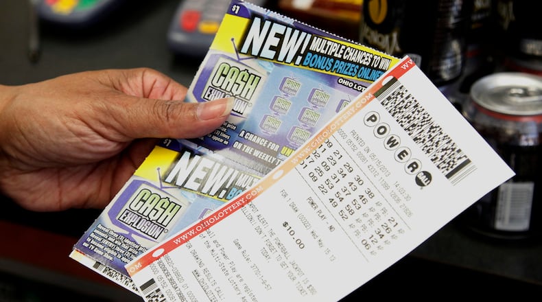 Dyan Gibbons (cq) of Dayton purchased Powerball tickets at the independent gas station at the corner of Woodman and Linden on Wednesday, May 15, 2013. "I'm just trying to make an easy dollar," Gibbons said. TY GREENLEES / STAFF