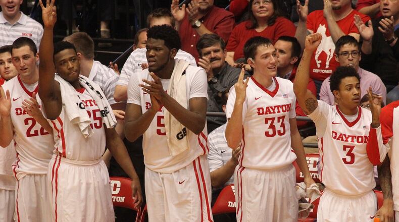 Dayton players cheer after a 3-pointer against Alabama on Tuesday, Nov. 17, 2015, at UD Arena in Dayton. David Jablonski/Staff