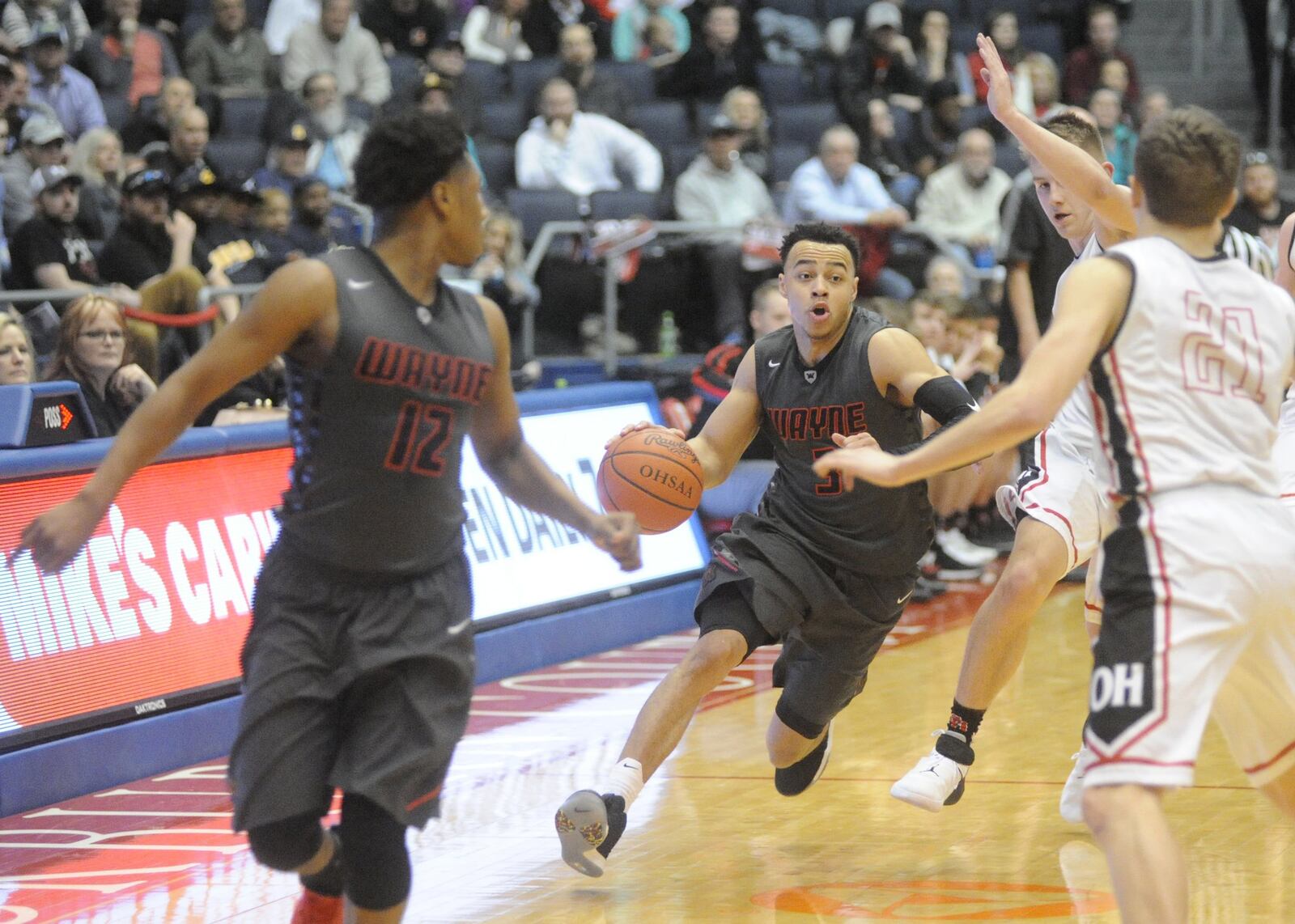 Wayne’s Darius Quisenberry (with ball) scored 19 points. Wayne defeated Oak Hills 68-54 in a D-I district final at UD Arena on Saturday, March 10, 2018. MARC PENDLETON / STAFF