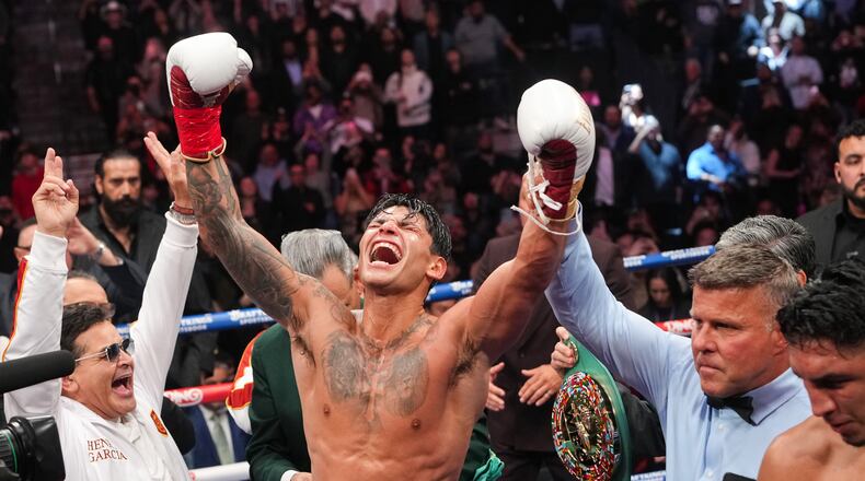 Ryan Garcia celebrates after winning in a WBC welterweight title boxing match against Mario Barrios Saturday, Feb. 21, 2026, in Las Vegas. (AP Photo/Lucas Peltier)