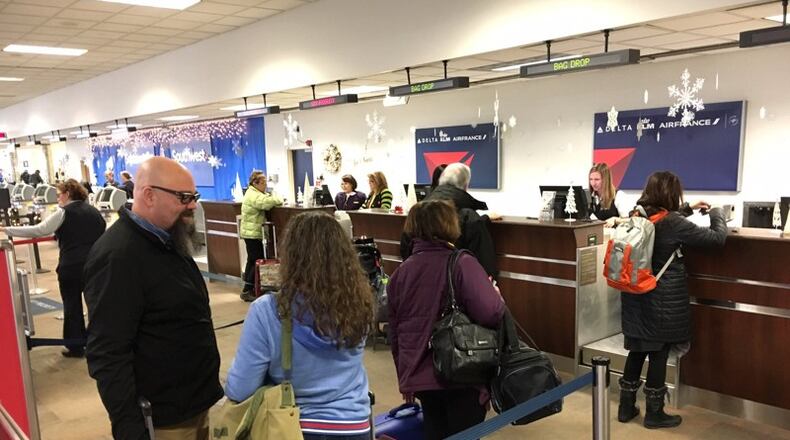 Travelers at the Dayton International Airport, Wednesday, Dec. 21, 2016.