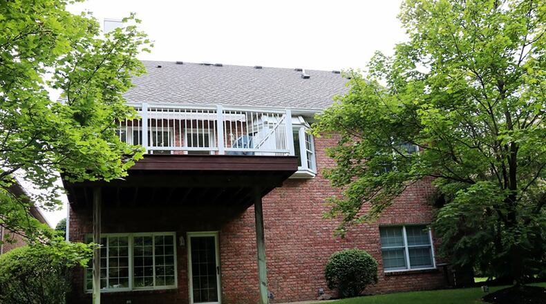 French doors open off the great room to a 4-season room with access to the balcony composite deck.