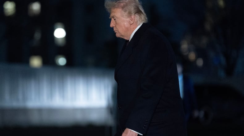 President Donald Trump walks on the South Lawn upon his arrival to the White House, Sunday, March 15, 2026, in Washington. (AP Photo/Jose Luis Magana)