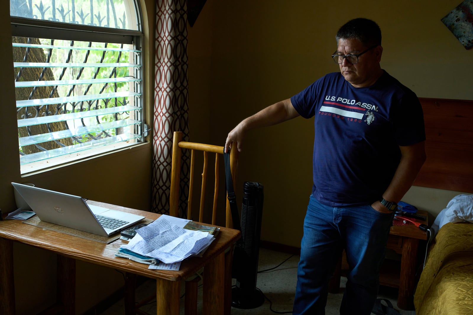 Jorge Beltran, a journalist who served in the Salvadoran military during the country's civil war and who left the country fearing political persecution, poses for a photo on Tuesday, July 22, 2025. (AP Photo/Moises Castillo)