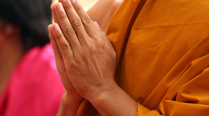 Mindfulness techniques come from the Buddhist tradition, where the practitioner pays attention to the ongoing flux of experience, simply observing what happens. iSTOCK/COX