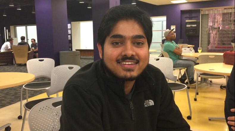Nathan Balasubramanian, a graduate student from India, sits at a dinner celebrating international education week at Wright State. Balasubramanian said he is worried about what the election of Donald Trump will mean for him and his peers. MAX FILBY/ STAFF
