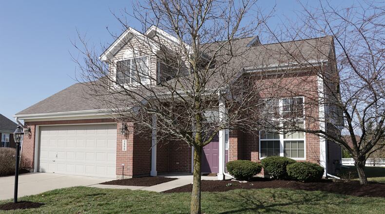 The brick-and-vinyl home offers 3 bedrooms and has about 1,565 sq. ft. of living space. The house is located on a cul-de-sac with a 2-car garage, a rear concrete patio and a first-floor bedroom suite. CONTRIBUTED PHOTO BY KATHY TYLER