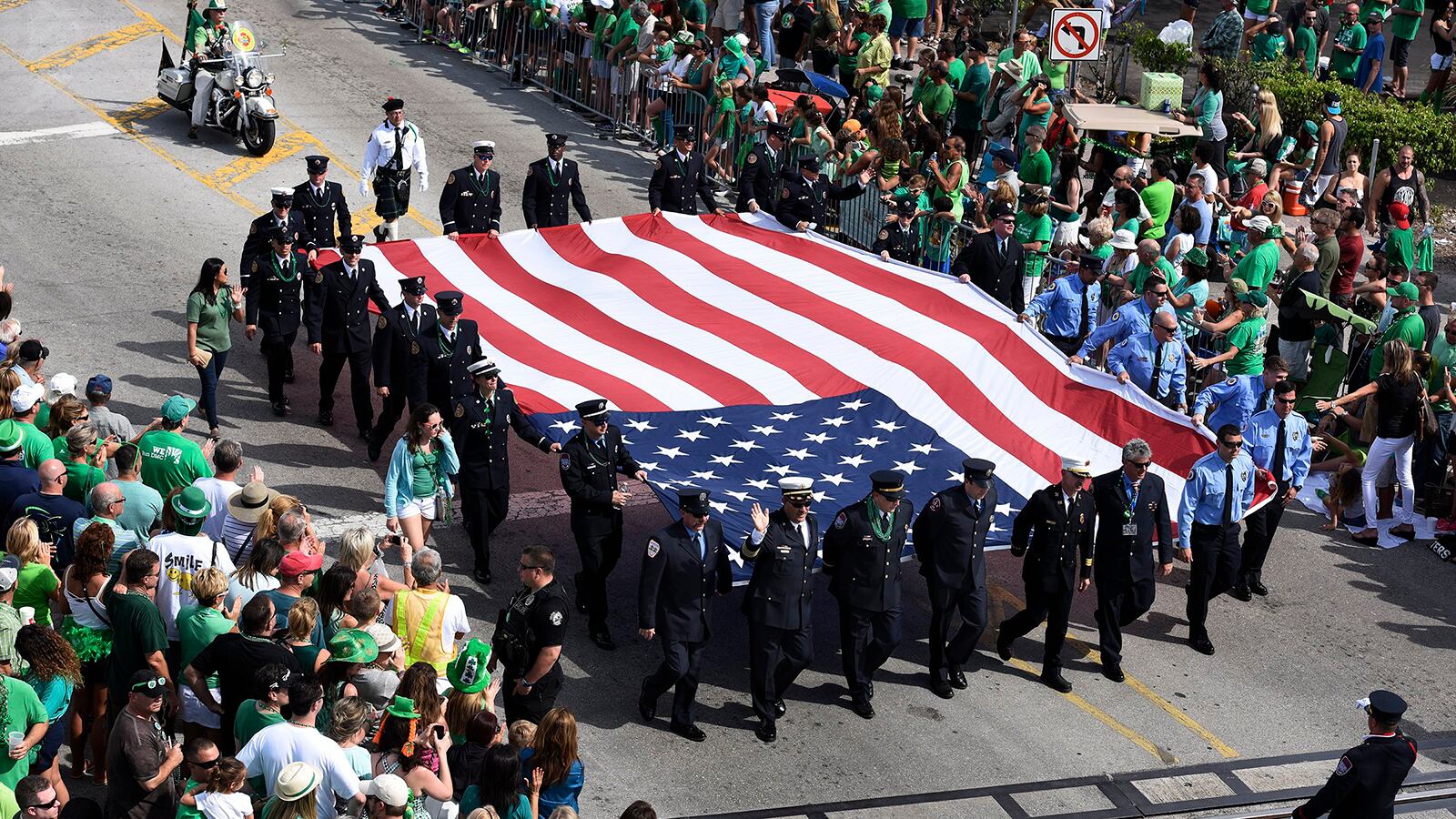 Firefighters carry the flag along Atlantic Avenue during the St. Patrick's Day Parade in Delray Beach on Saturday, March 12, 2016. (Palm Beach Post file photo)