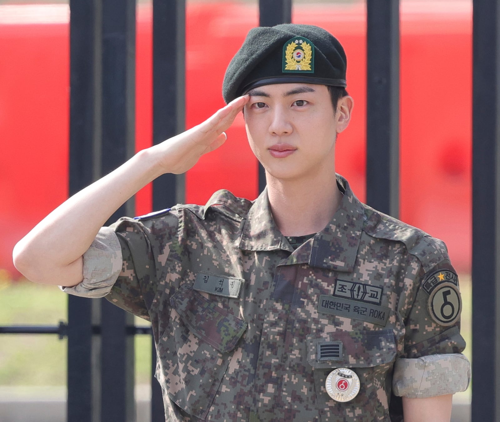 FILE - K-pop band BTS's member Jin salutes after being discharged from a mandatory military service outside of an army base in Yeoncheon, South Korea, Wednesday, June 12, 2024. (Im Byung-shik/Yonhap via AP, File)