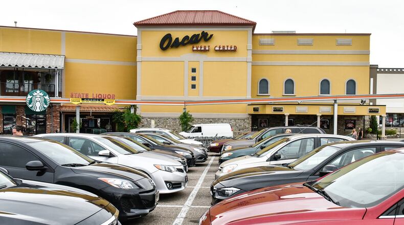 Vehicles are parked outside of the Oscar Event Center at Jungle Jim’s International Market Friday, July 6 in Fairfield. NICK GRAHAM/STAFF