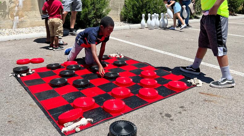 Saturday's Juneteenth celebration held by Genuine Work in downtown Dayton offered activities for kids, food trucks, music, and art. AIMEE HANCOCK/STAFF