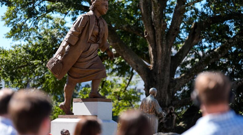 People view a newly unveiled statue of Rosa Parks on the grounds of the Alabama State Capitol, Friday, Oct. 24, 2025, in Montgomery, Ala. (AP Photo/Mike Stewart)
