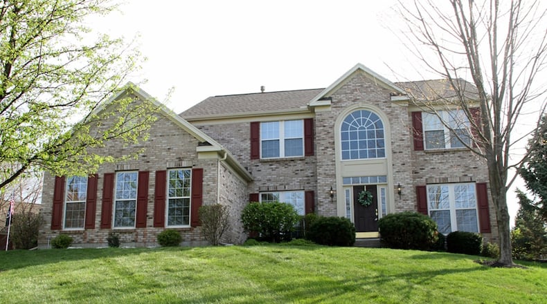The house sits diagonally on a corner lot with extra parking pad near the 2-car, side-entry garage. The house has 4 bedrooms and a full, unfinished basement. CONTRIBUTED PHOTOS BY KATHY TYLER