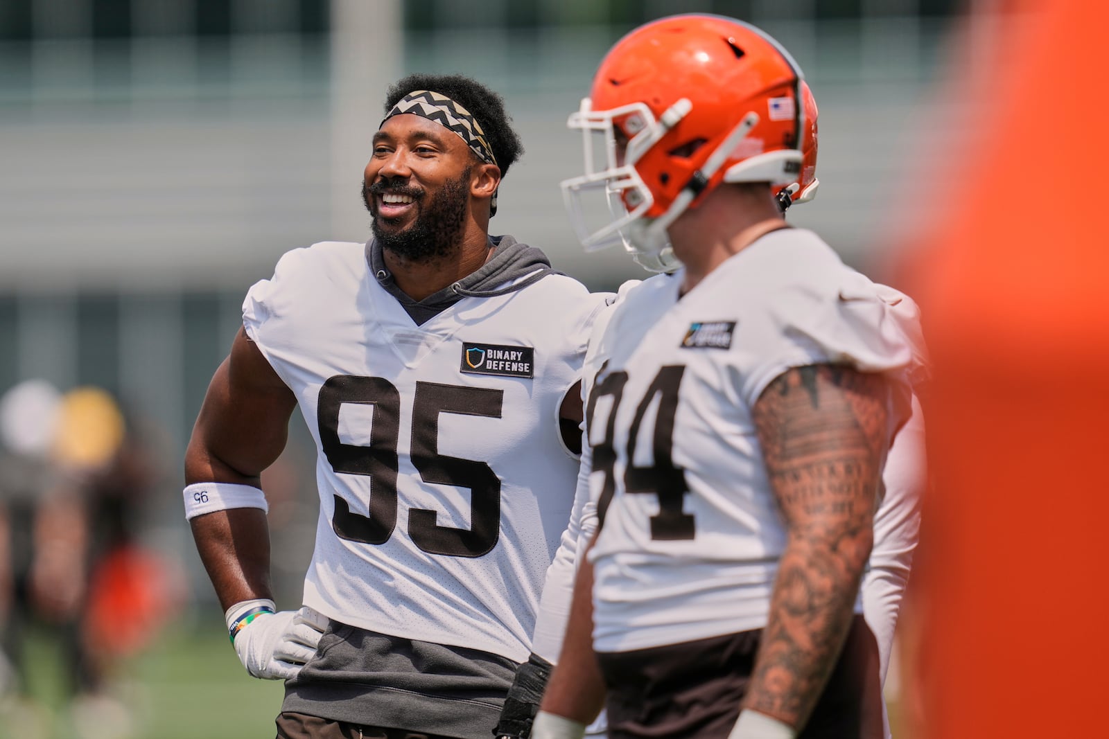 Cleveland Browns defensive end Myles Garrett (95) and defensive tackle Mason Graham (94) are pictured at NFL football minicamp in Berea, Ohio, Tuesday, June 10, 2025. (AP Photo/Sue Ogrocki)