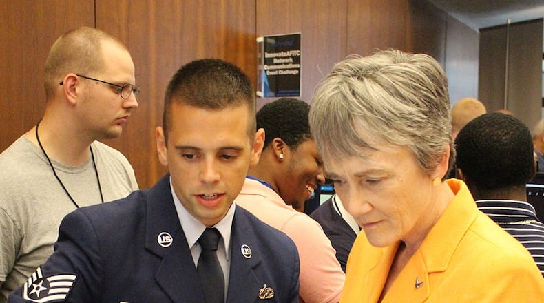 Staff Sgt. Sean Medlin (left), Lead Android developer for the Business and Enterprise Systems Directorate, explains the directorate’s first mobile application prototype to Secretary of the Air Force Dr. Heather Wilson during the Air Force Information Technology Conference in Montgomery, Ala., in August 2018. (U.S. Air Force photo/Ryan McCain)