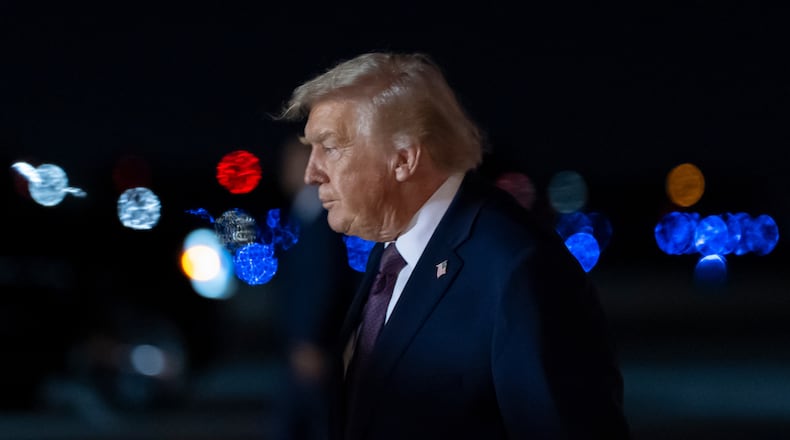 President Donald Trump arrives on Air Force One at Palm Beach International Airport, Saturday, Dec. 20, 2025, in West Palm Beach, Fla. (AP Photo/Alex Brandon)