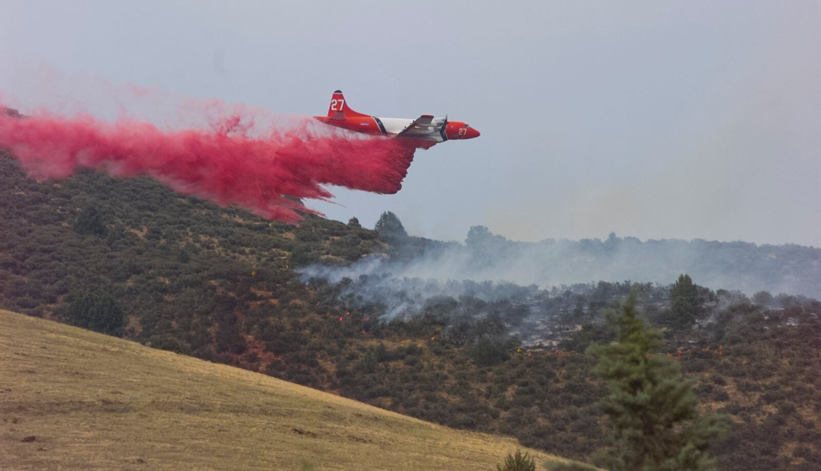 Orion P-3 fire bomber does its work in Yreka, California, 1997.