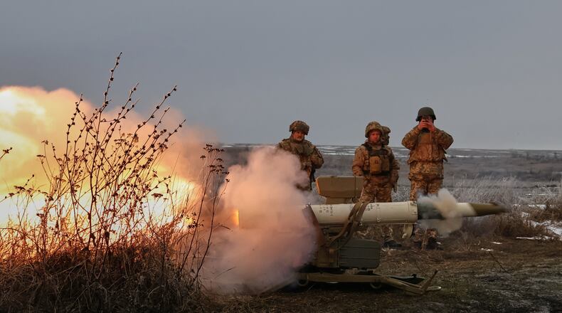 In this photo provided by Ukraine's 65th Mechanized Brigade press service, soldiers fire an anti-tank missile system during a drill close to the frontline on the site of heavy battles with the Russian troops in the Zaporizhzhia region, Ukraine, Sunday, Jan. 4, 2026. (Andriy Andriyenko/Ukraine's 65th Mechanized Brigade via AP)