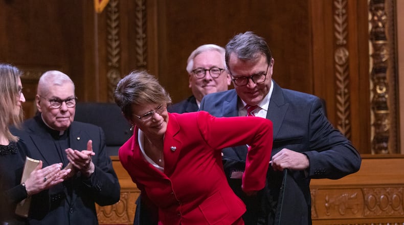 Ohio Supreme Court Chief Justice Sharon Kennedy dons robe of her mentor retired Butler County Common Pleas Judge Matthew Crehan who died Tuesday. OHIO SUPREME COURT