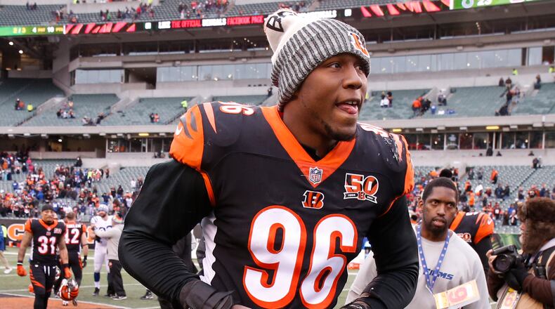 Cincinnati Bengals defensive end Carlos Dunlap runs off the field after an NFL football game against the Indianapolis Colts, Sunday, Oct. 29, 2017, in Cincinnati. The Bengals won 24-23. (AP Photo/Gary Landers)