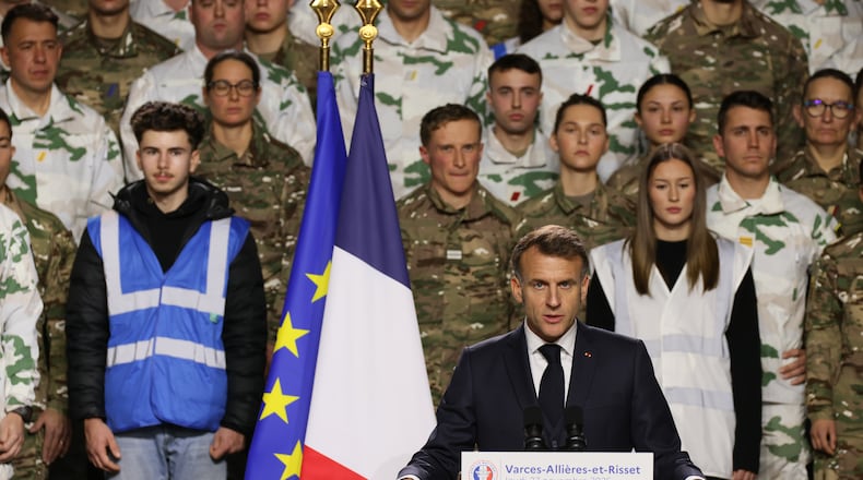 France's President Emmanuel Macron, unveils a new national military service as he speaks to the army at the military base in Varces, French Alps, Thursday, Nov. 27, 2025.(AP Photo/Thomas Padilla, Pool)